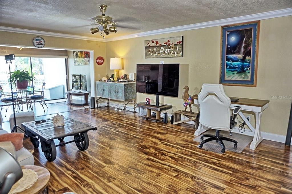 1873 Mazo Manor Road, Unit 5 Lutz, FL 33558 - Photo 5 of 41 a living room with furniture and a flat screen tv