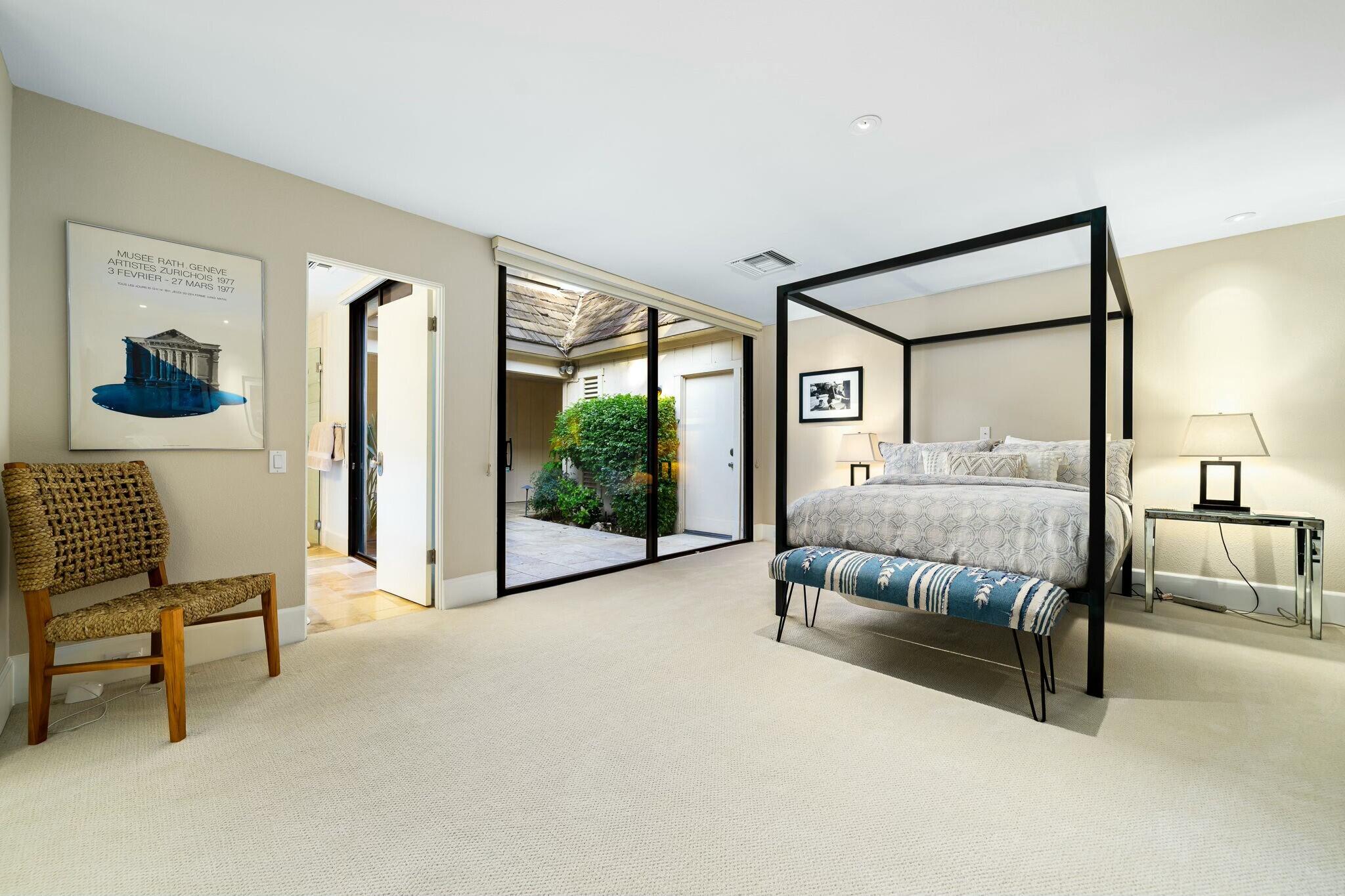 7 Princeton Drive Rancho Mirage, CA 92270 - Photo 23 of 39 a bedroom with a bed and a view of en suite bathroom