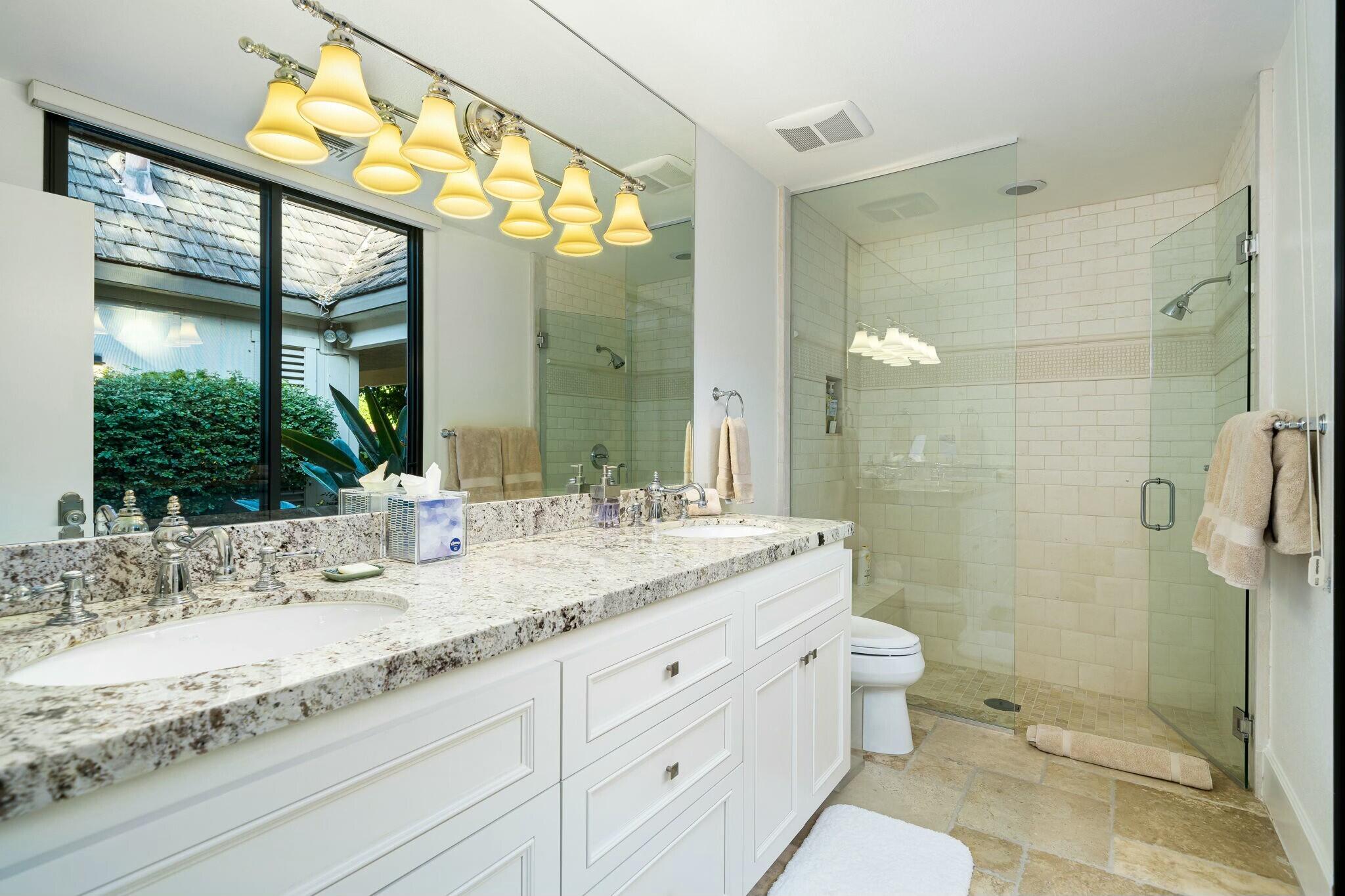 7 Princeton Drive Rancho Mirage, CA 92270 - Photo 24 of 39 a bathroom with a granite countertop sink toilet and shower