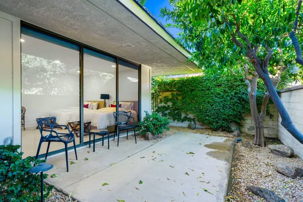 a view of an chairs and tables in the patio