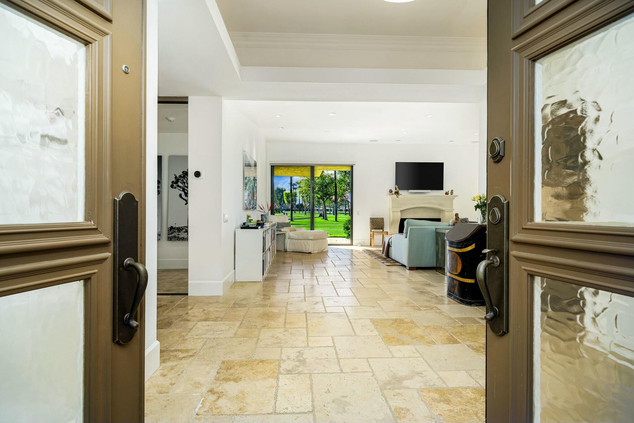 7 Princeton Drive Rancho Mirage, CA 92270 - Photo 3 of 39 a view of a livingroom with a flat screen tv and a couch