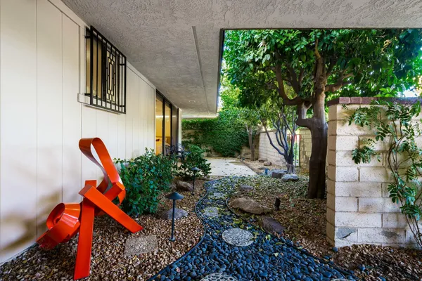 a view of a swimming pool with a yard