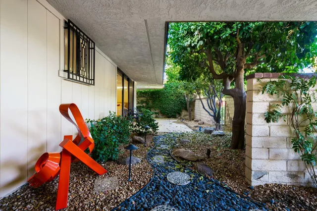 a view of a swimming pool with a yard