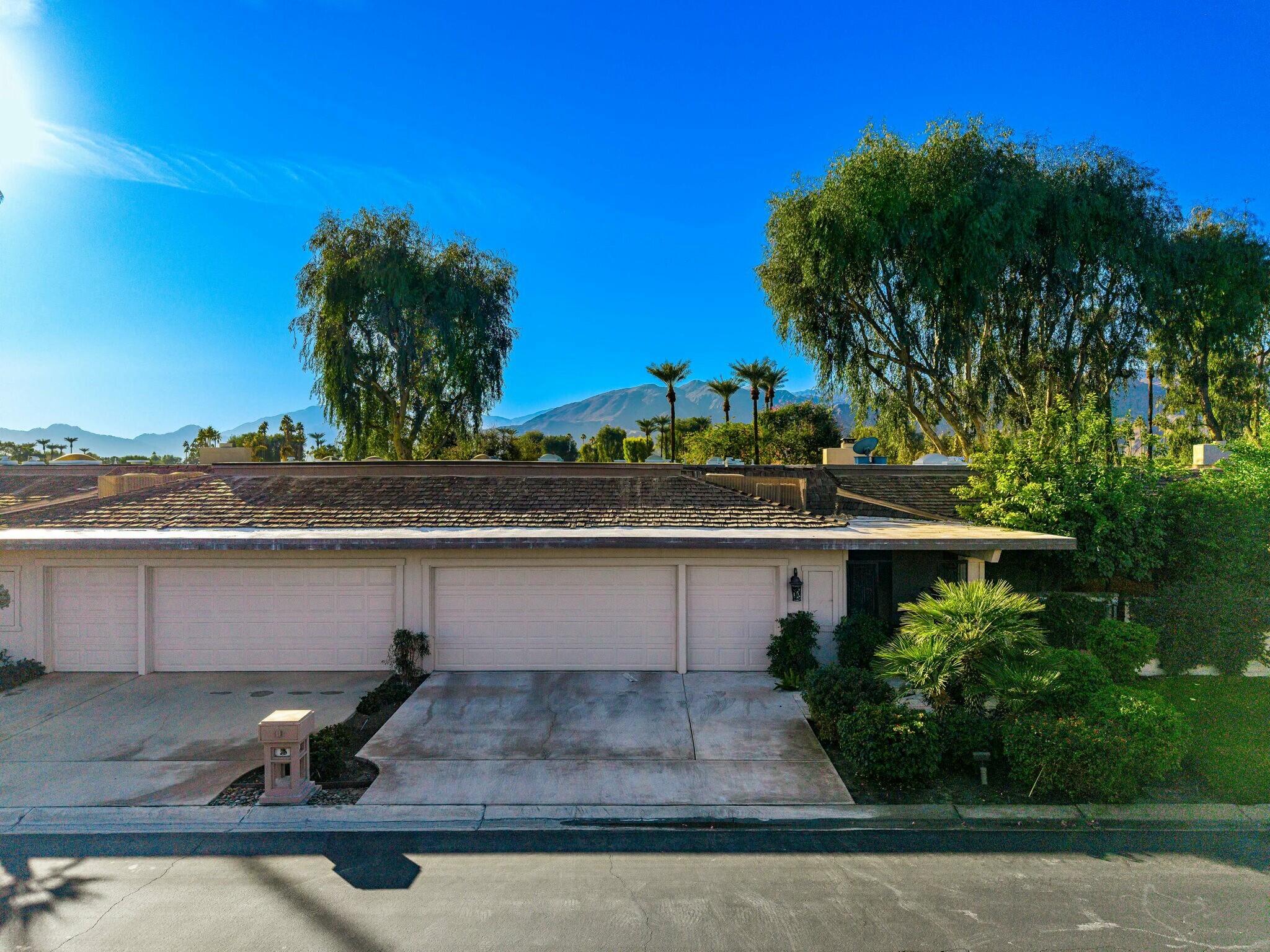 7 Princeton Drive Rancho Mirage, CA 92270 - Photo 35 of 39 a view of a swimming pool with a yard