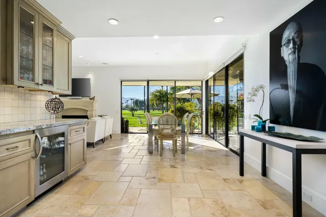 a lobby with furniture and large windows