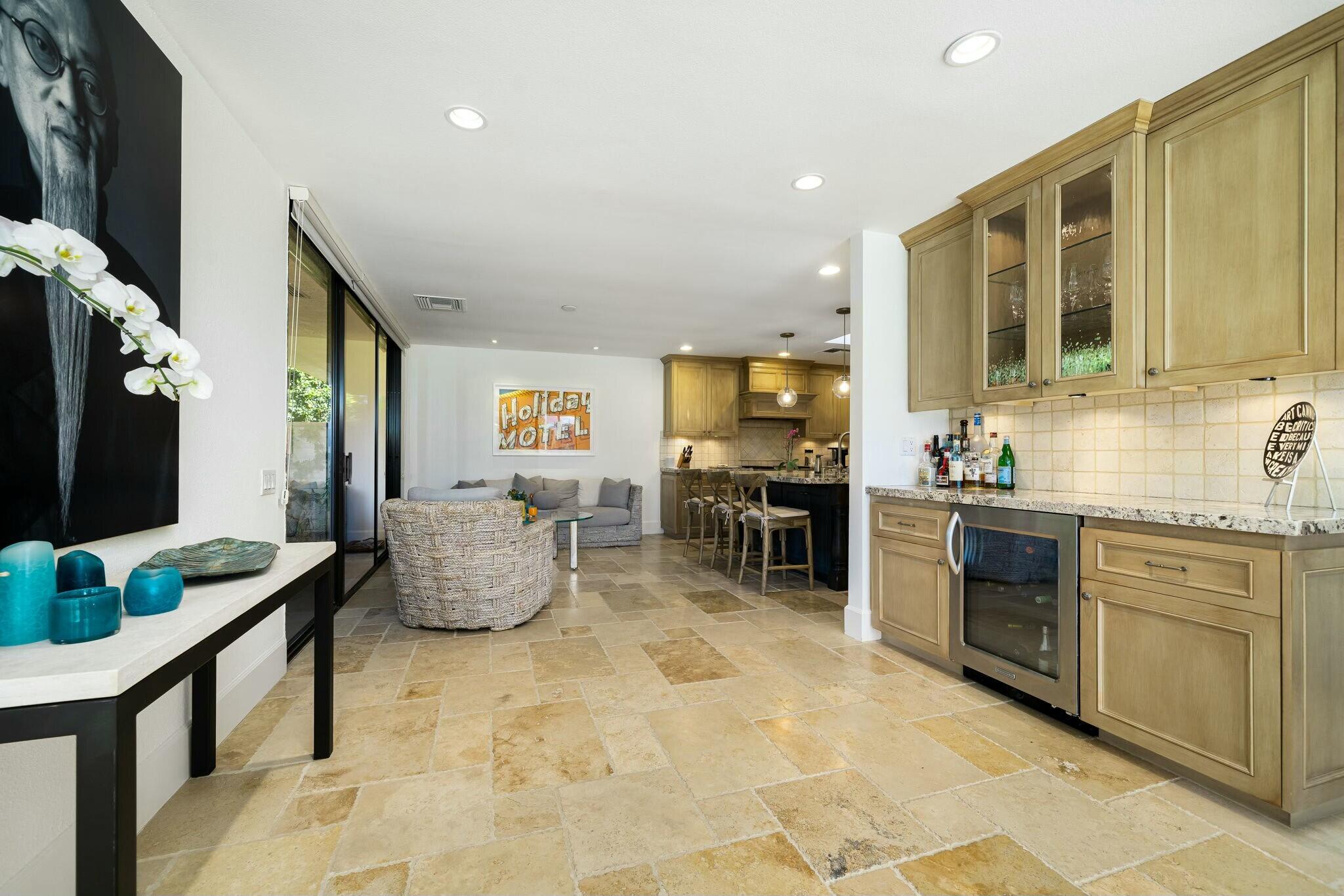 7 Princeton Drive Rancho Mirage, CA 92270 - Photo 10 of 39 a living room with furniture flat screen tv and kitchen view