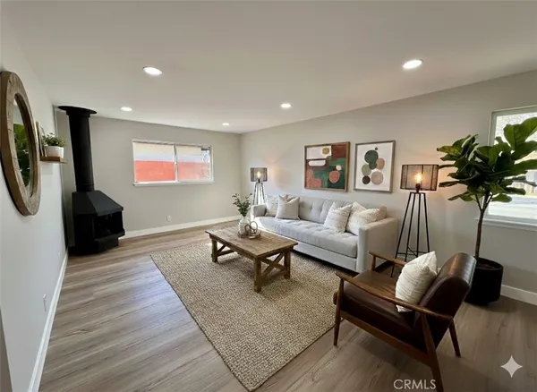 a living room with furniture and a rug