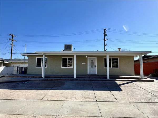 a view of a house with wooden deck