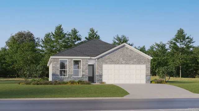 a front view of a house with a garden and yard