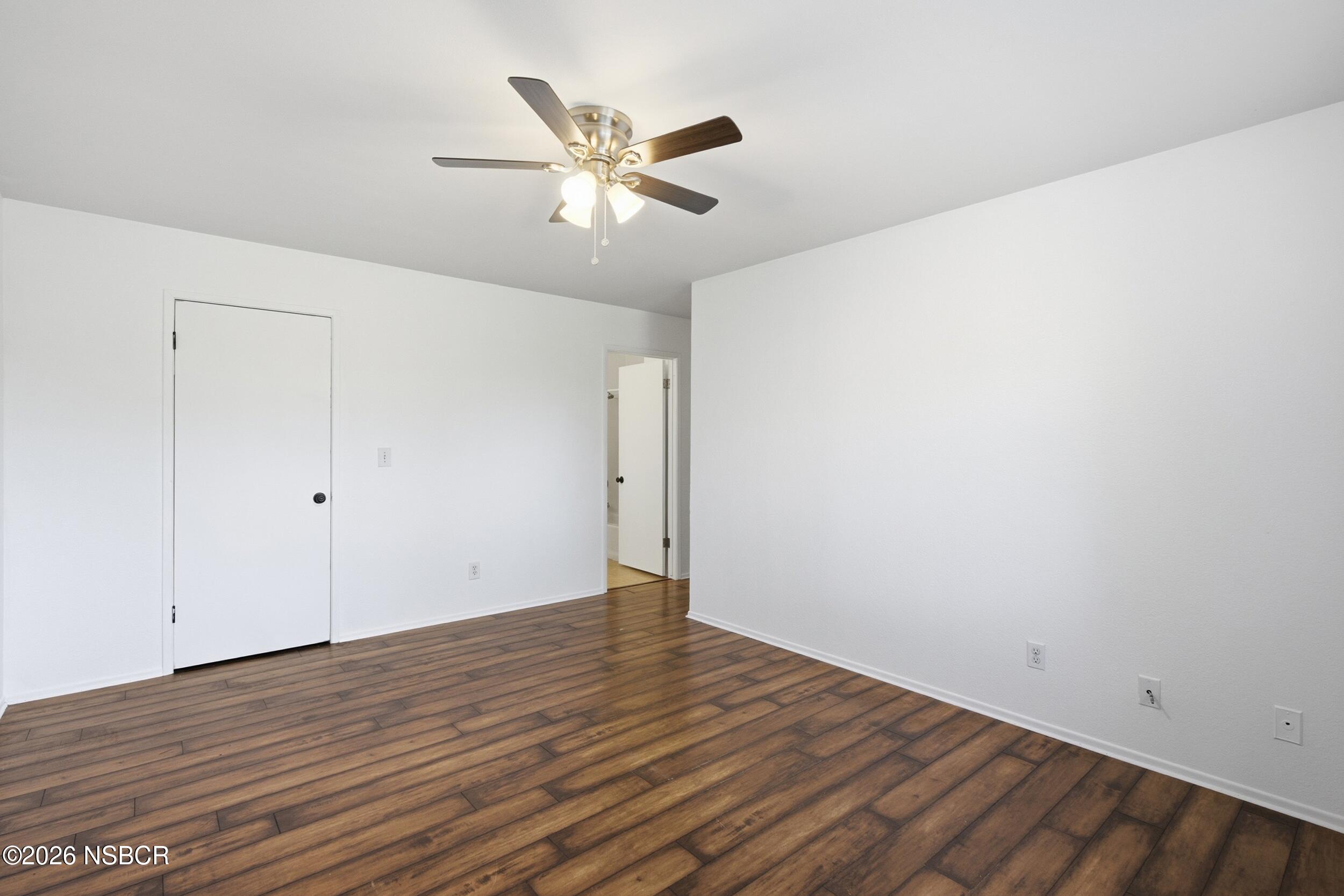 3350 Santa Maria Way, Unit 104A Santa Maria, CA 93455 - Photo 17 of 23 a view of an empty room with wooden floor