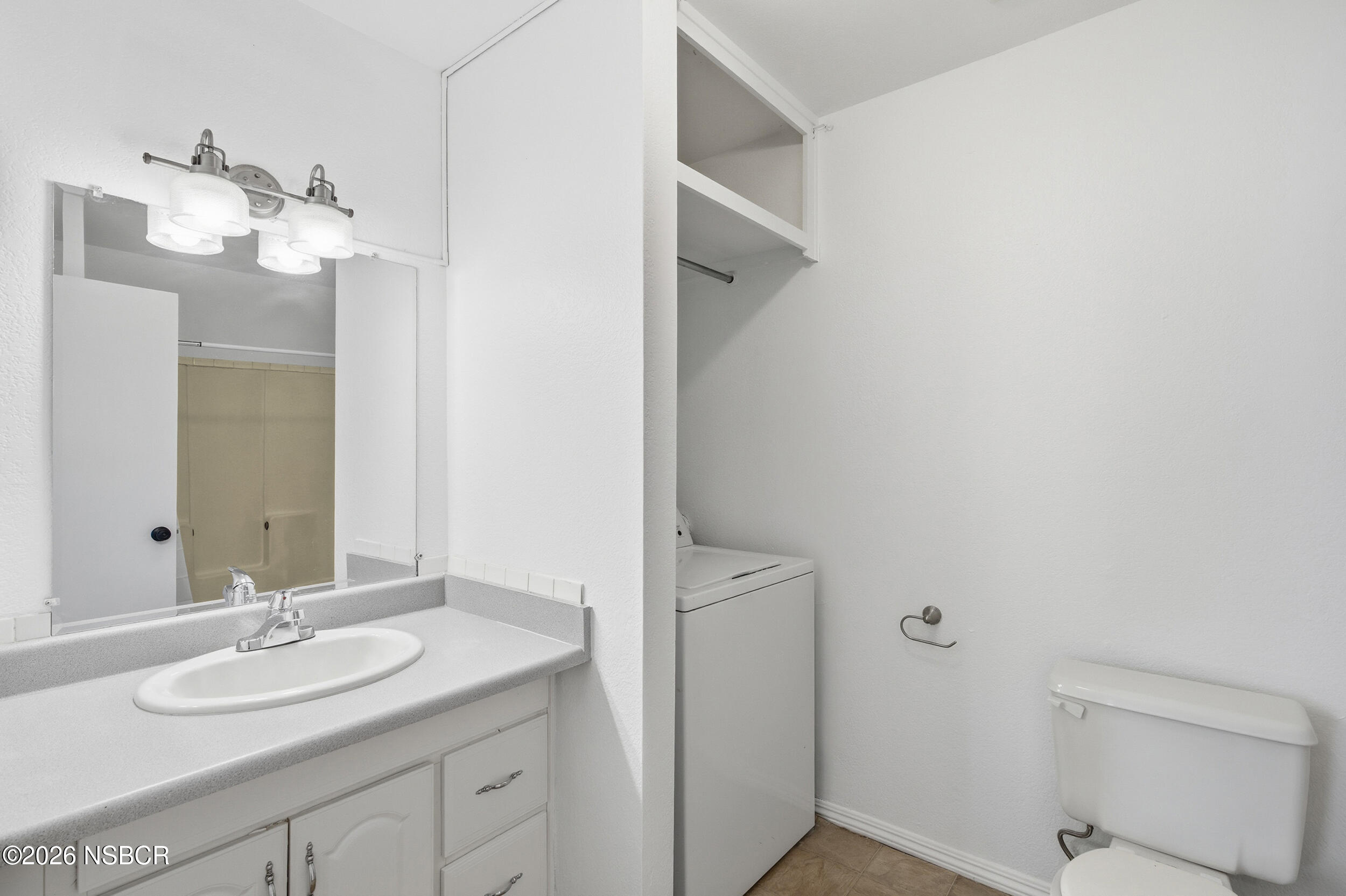 3350 Santa Maria Way, Unit 104A Santa Maria, CA 93455 - Photo 18 of 23 a bathroom with a sink and a mirror