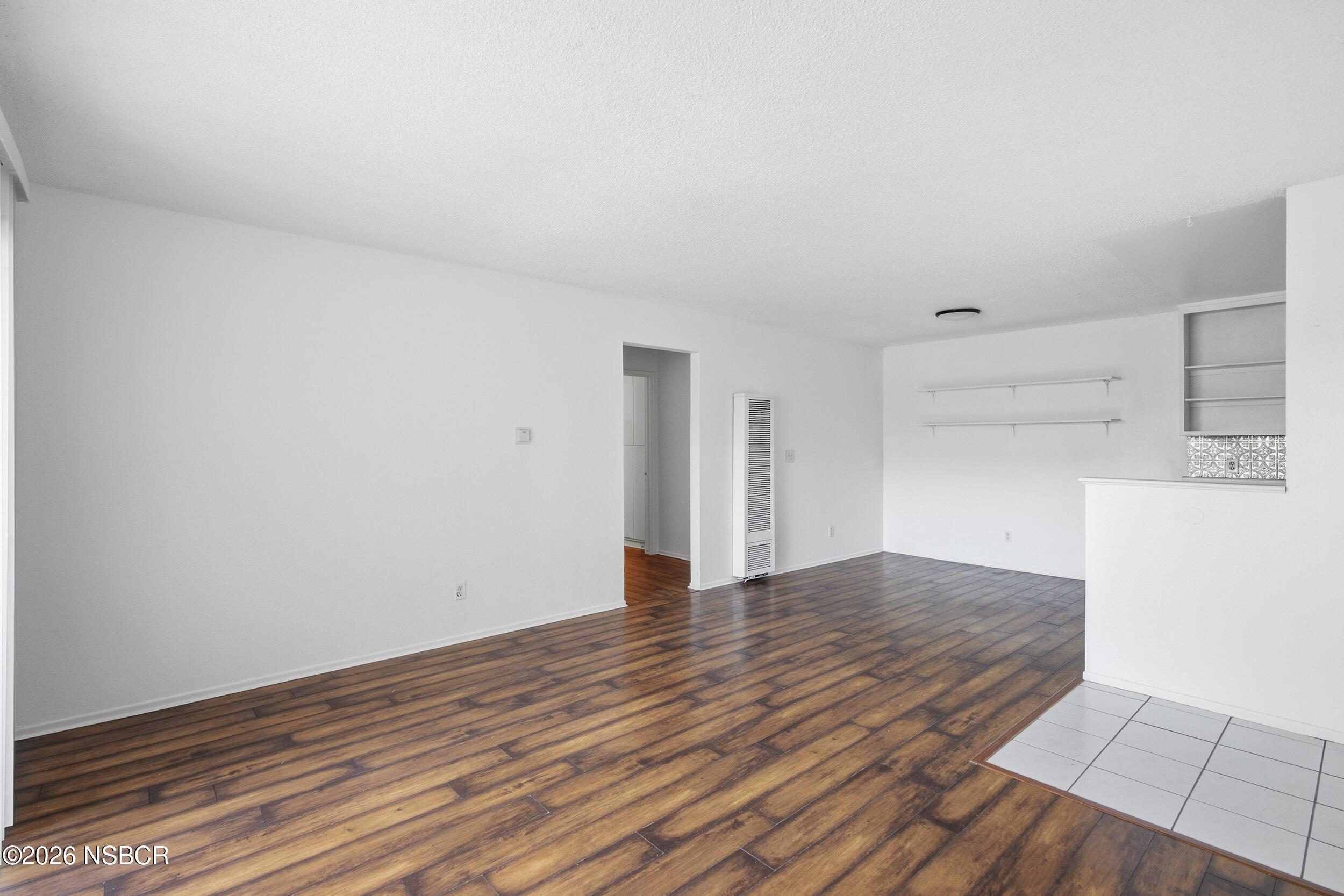 3350 Santa Maria Way, Unit 104A Santa Maria, CA 93455 - Photo 6 of 23 a view of an empty room with wooden floor