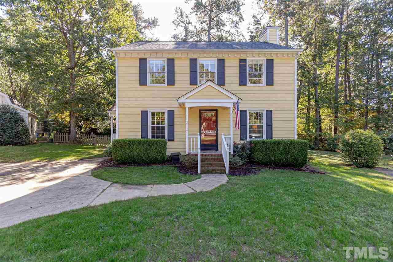 1212 Oakside Court Raleigh, NC 27609 - Photo 1 of 25 a front view of a house with a yard