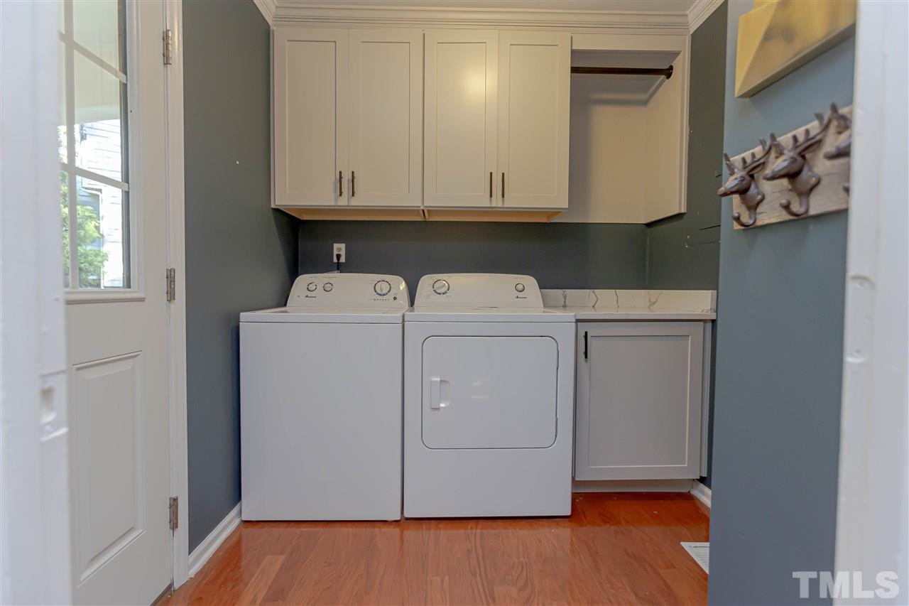 1212 Oakside Court Raleigh, NC 27609 - Photo 14 of 25 a utility room with dryer and washer