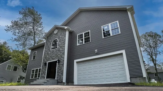 a front view of a house with stairs