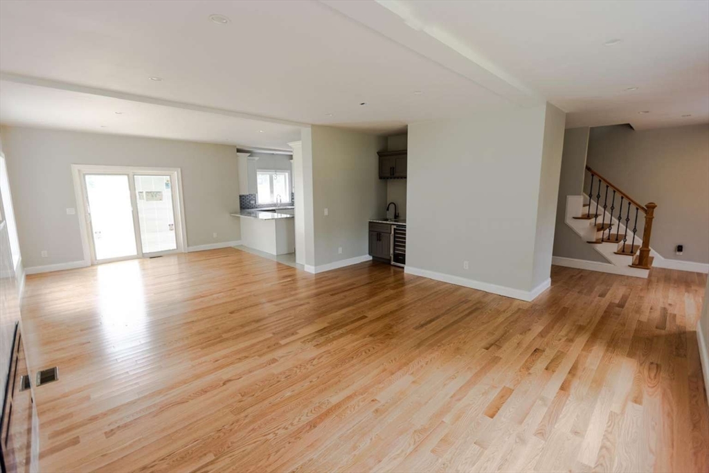 217 Prospect Street Auburn, MA 01501 - Photo 7 of 41 a view of an empty room with wooden floor and a window