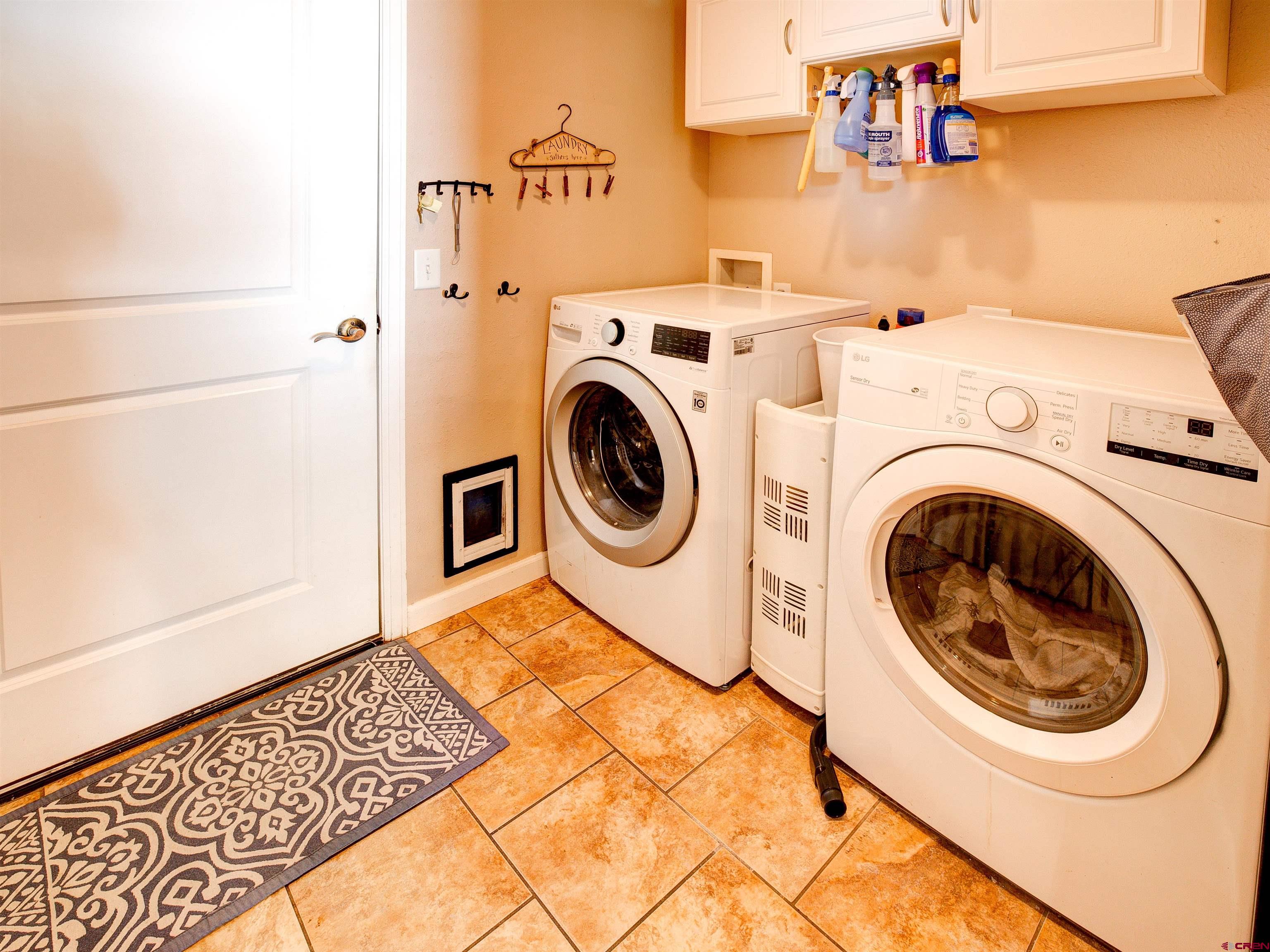 2942 F 1/4 Road Grand Junction, CO 81504 - Photo 14 of 32 a utility room with dryer and washer