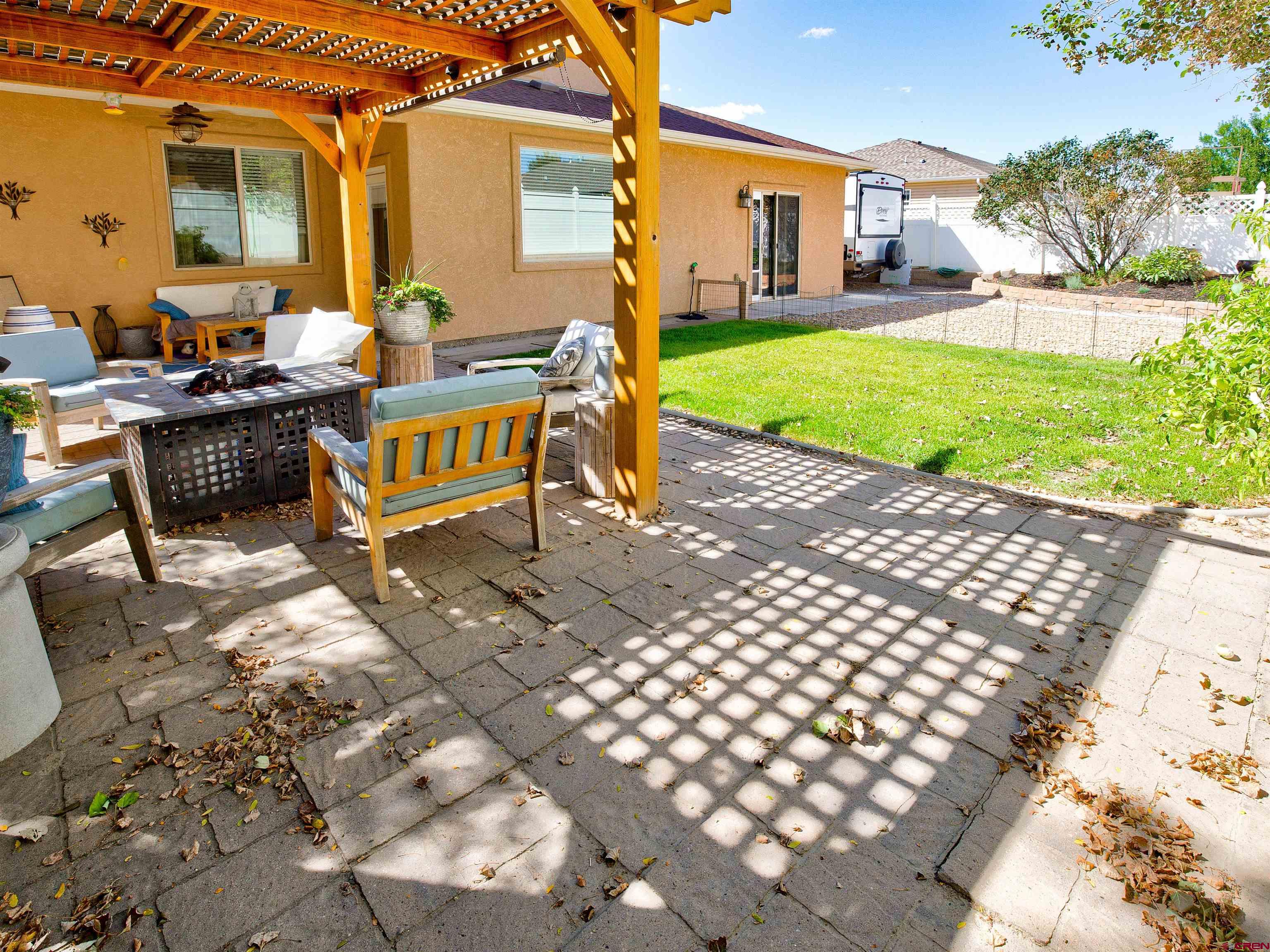 2942 F 1/4 Road Grand Junction, CO 81504 - Photo 29 of 32 a view of a patio with table and chairs near a yard