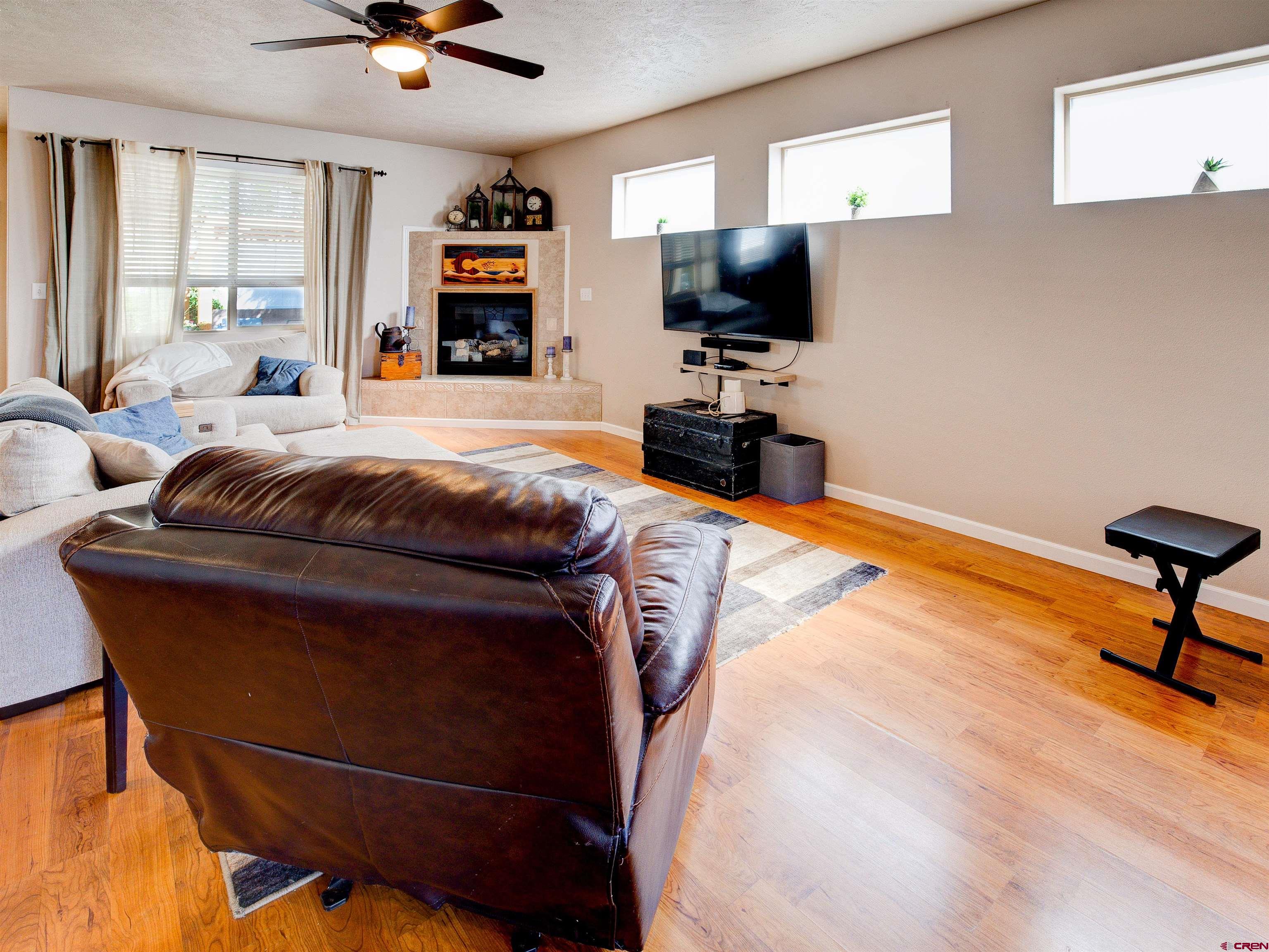 2942 F 1/4 Road Grand Junction, CO 81504 - Photo 4 of 32 a living room with furniture and a flat screen tv