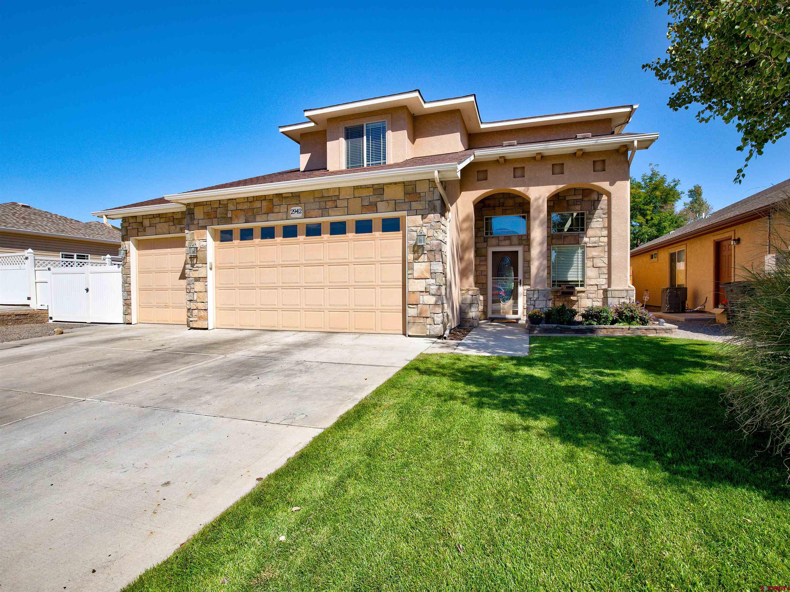 2942 F 1/4 Road Grand Junction, CO 81504 - Photo 31 of 32 a front view of a house with a yard