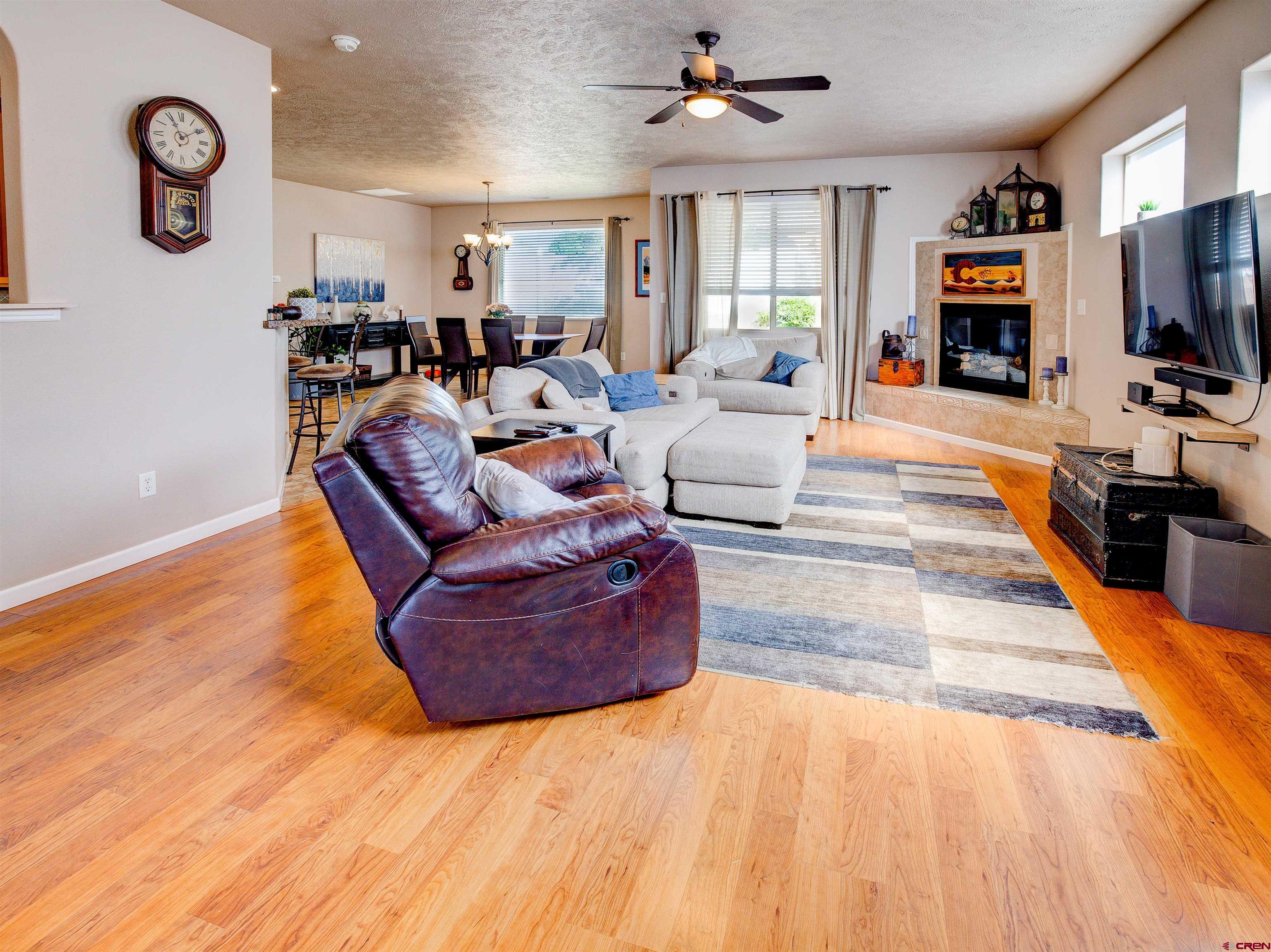 2942 F 1/4 Road Grand Junction, CO 81504 - Photo 5 of 32 a living room with furniture large window and flat screen tv