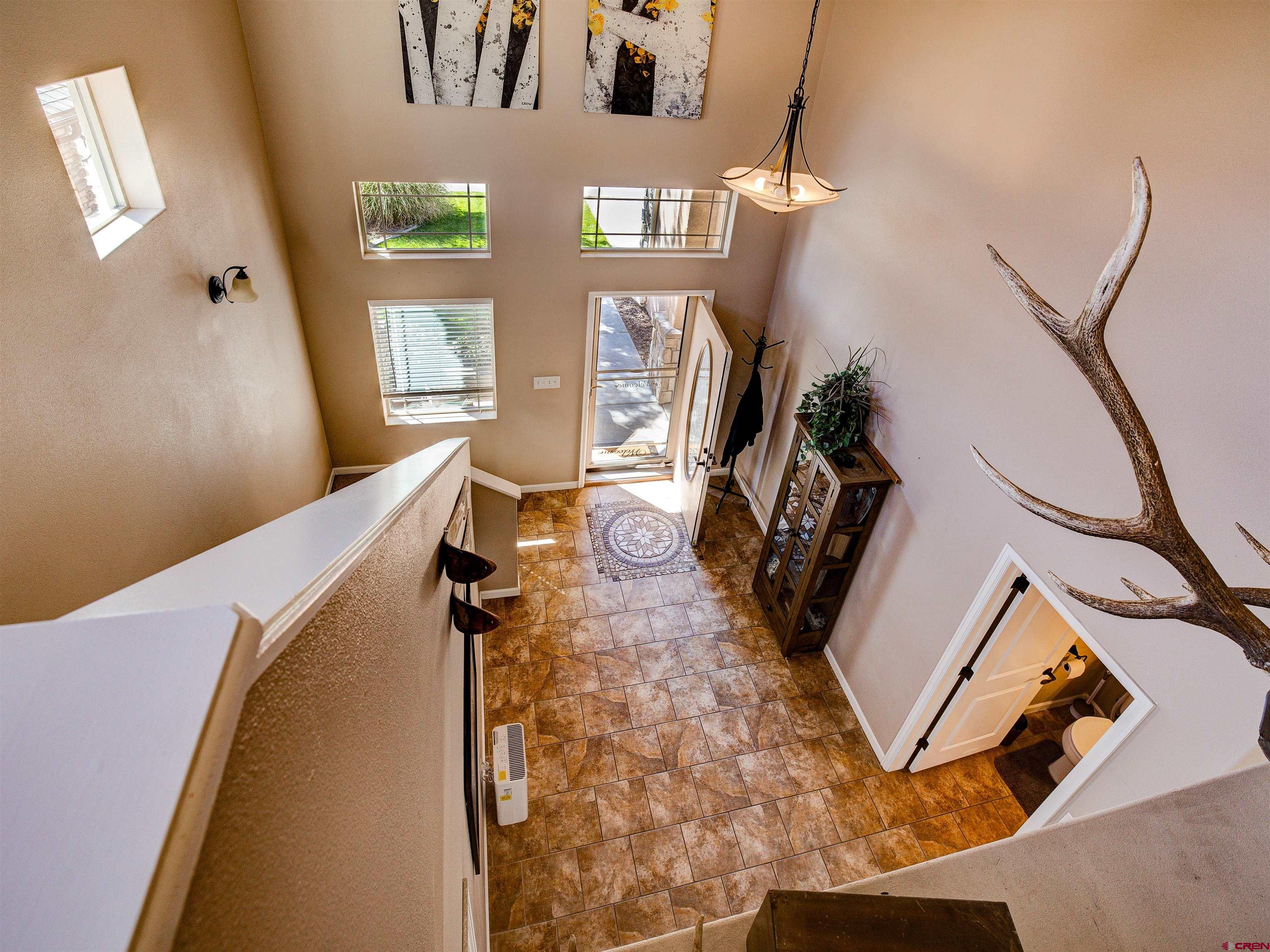 2942 F 1/4 Road Grand Junction, CO 81504 - Photo 6 of 32 a view of a living room with furniture and a window
