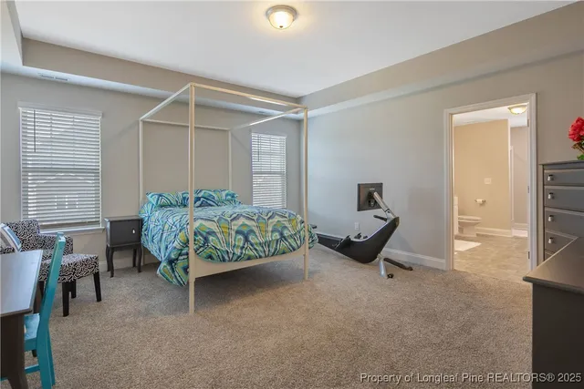 a bedroom with furniture and a window