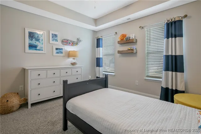 a bedroom with a bed and a cabinets