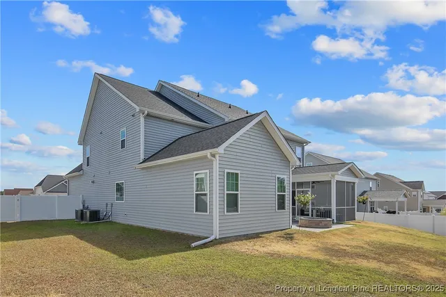a view of a house with a yard and garage
