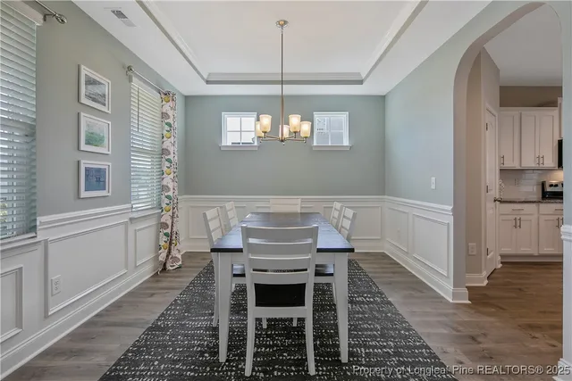 a view of a livingroom with furniture window and wooden floor