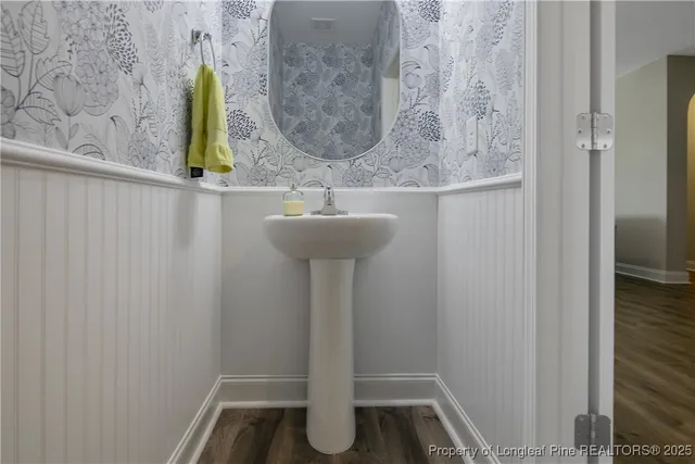 a bathroom with a sink and mirror