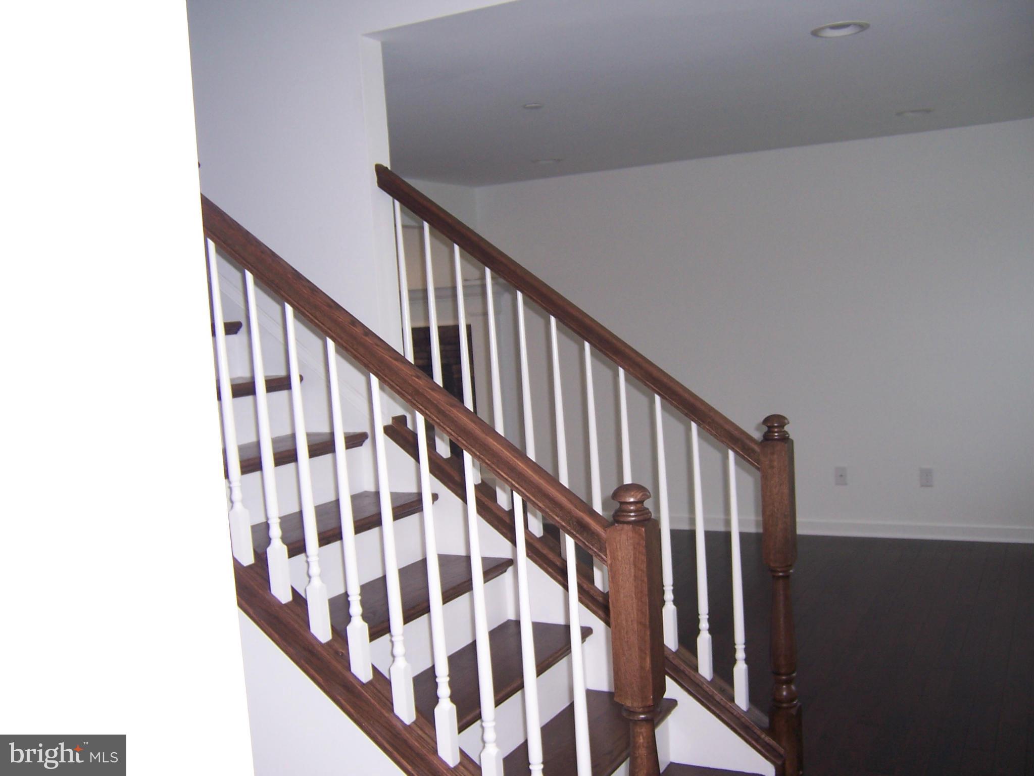 11741 Ashton Road Clear Spring, MD 21722 - Photo 5 of 9 a view of staircase with wooden floor and white walls