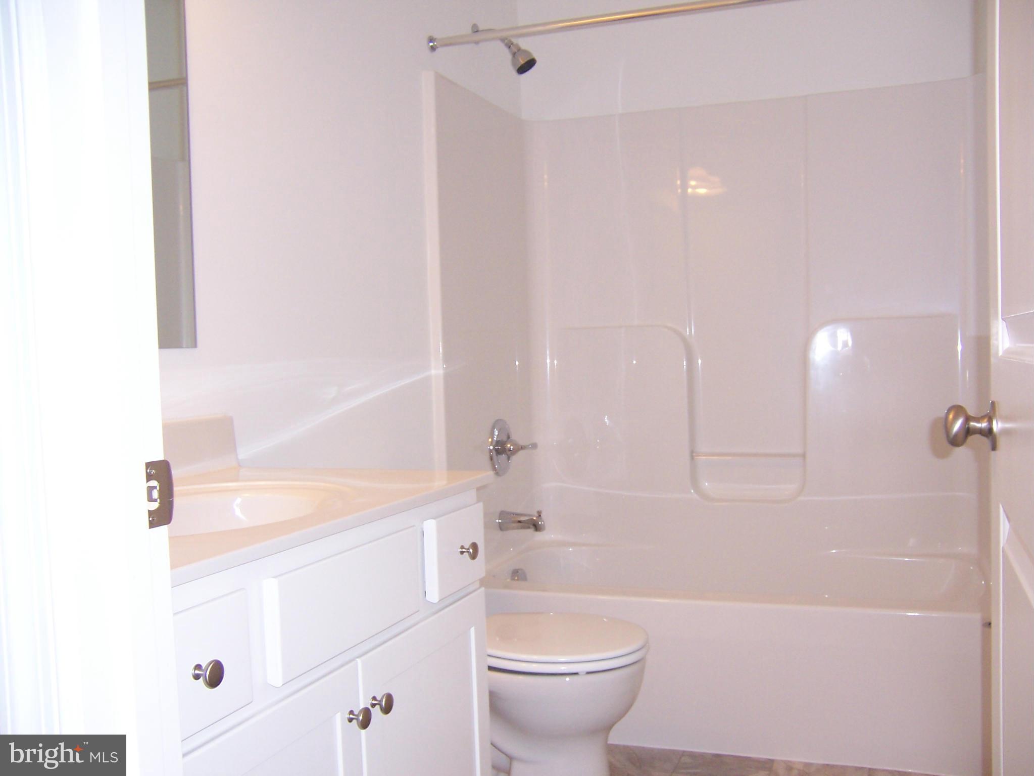 11741 Ashton Road Clear Spring, MD 21722 - Photo 7 of 9 a bathroom with a sink a toilet and a bathtub