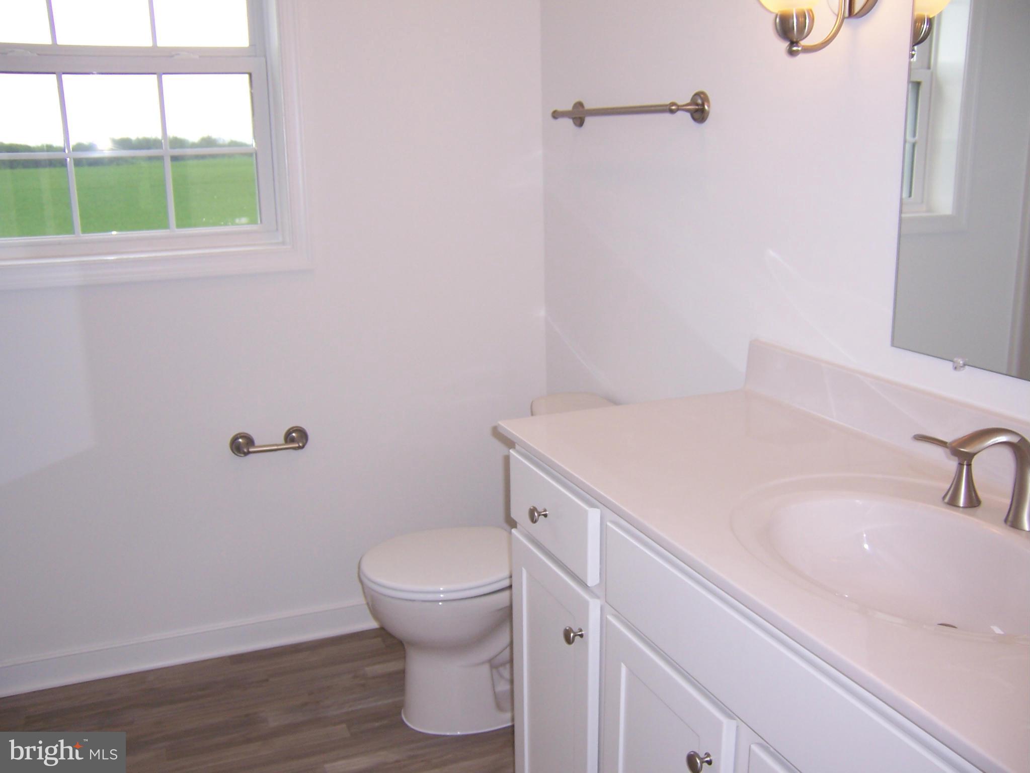 11741 Ashton Road Clear Spring, MD 21722 - Photo 8 of 9 a bathroom with a sink and toilet