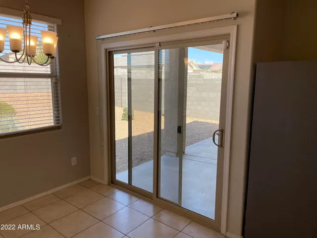 a view of a glass door and a living room