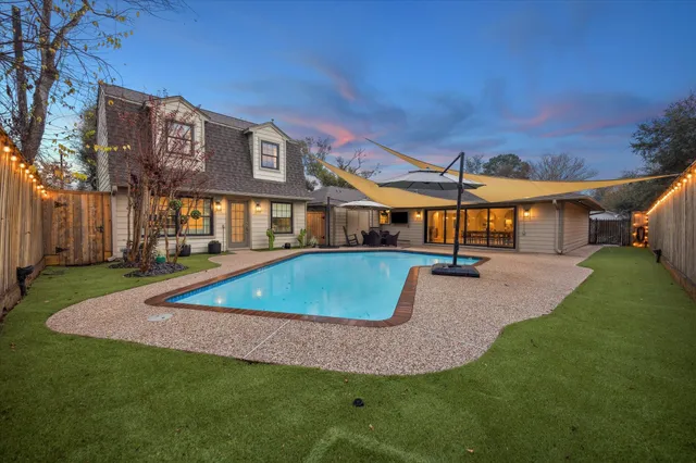 a view of a house with a swimming pool