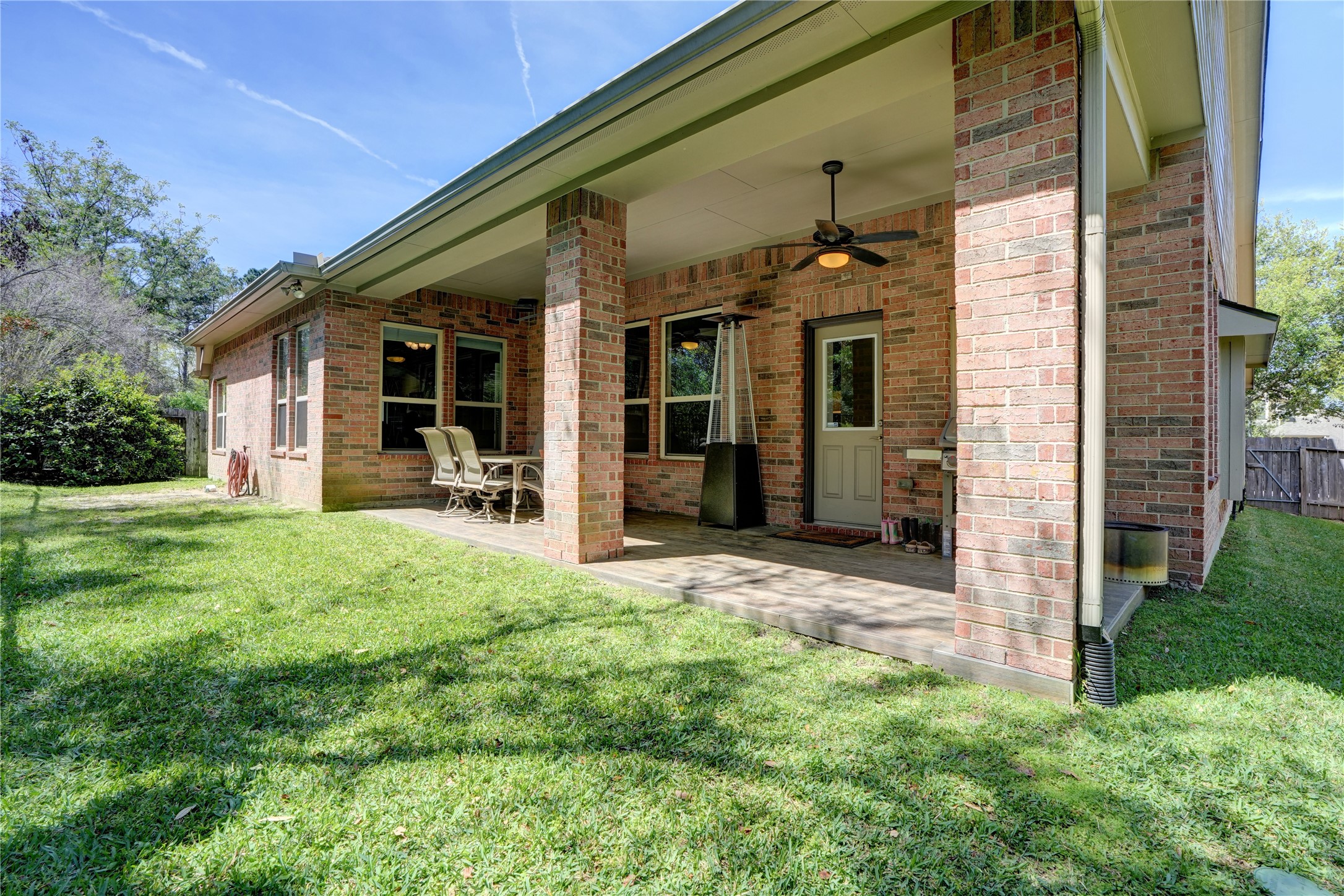 27243 Jessica Hills Lane Spring, TX 77386 - Photo 34 of 49 Covered patio with wood-look tile flooring.