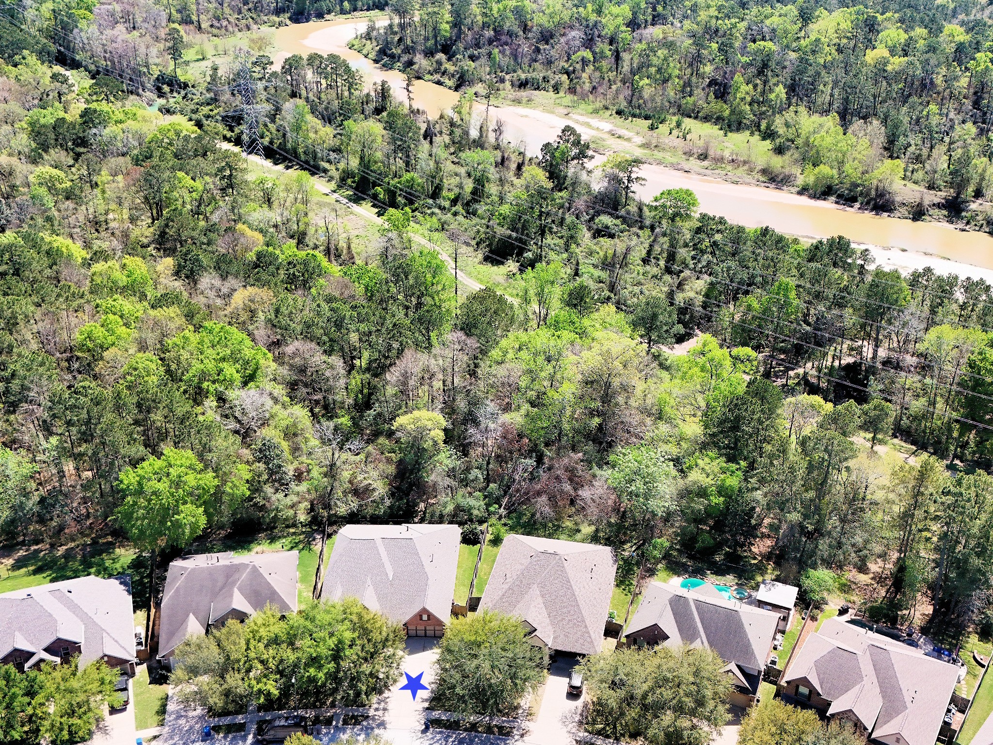 27243 Jessica Hills Lane Spring, TX 77386 - Photo 7 of 49 Discover serene living with this unique property backing onto a private nature reserve—step out your back gate to explore miles of scenic trails and enjoy direct access to the tranquil creek.