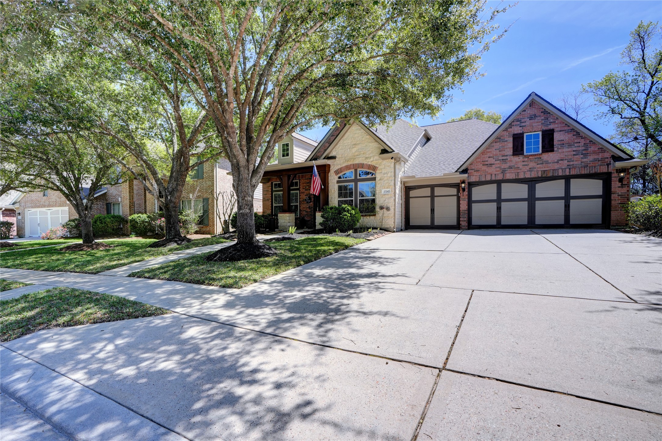 27243 Jessica Hills Lane Spring, TX 77386 - Photo 8 of 49 Discover the perfect blend of style and convenience with this hard-to-find home featuring a spacious 3-car garage and an extra-wide driveway, ensuring ample parking and storage for all your needs.