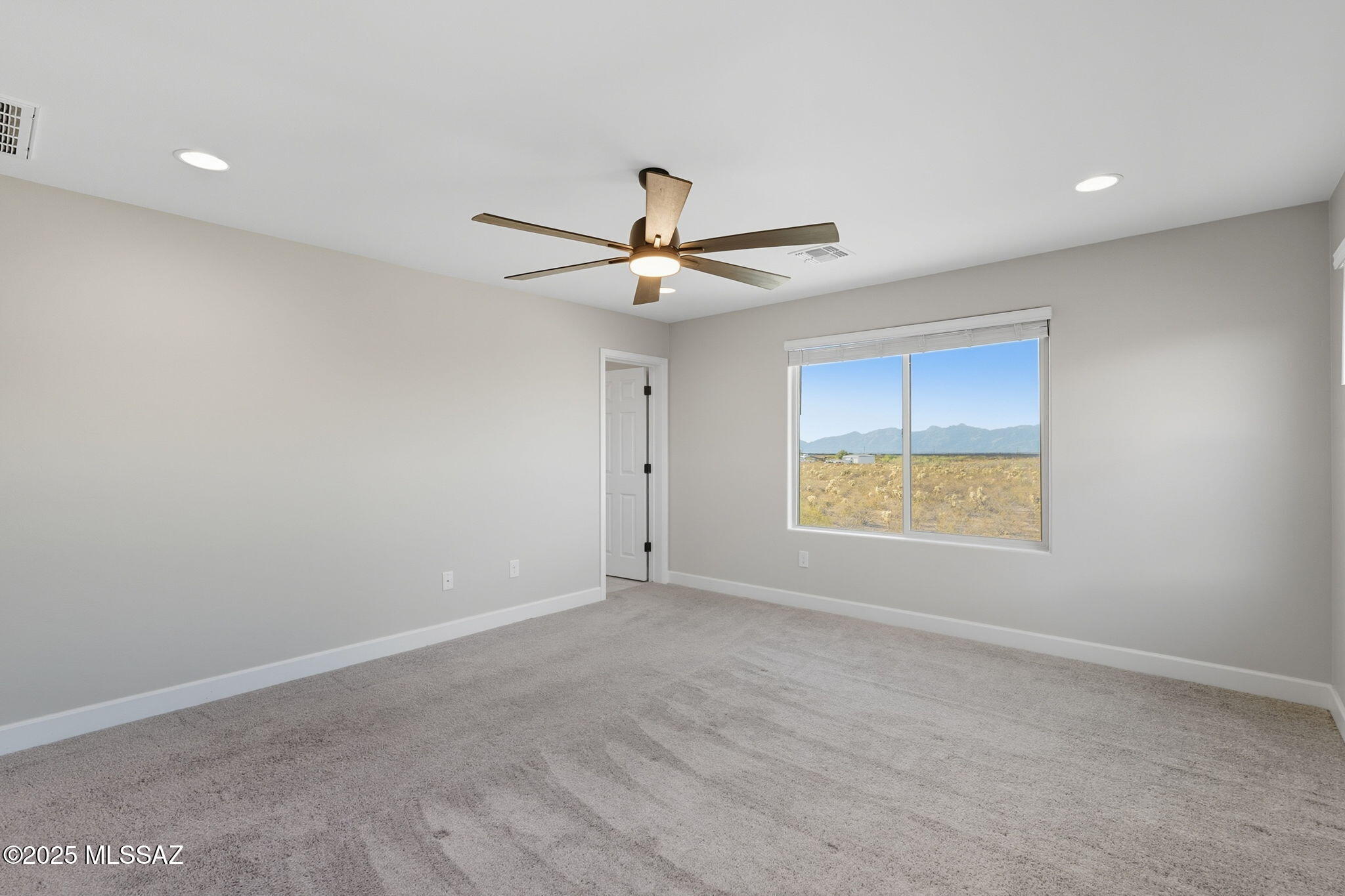 12100 East Ryscott Circle Vail, AZ 85641 - Photo 28 of 53 a view of an empty room with a window