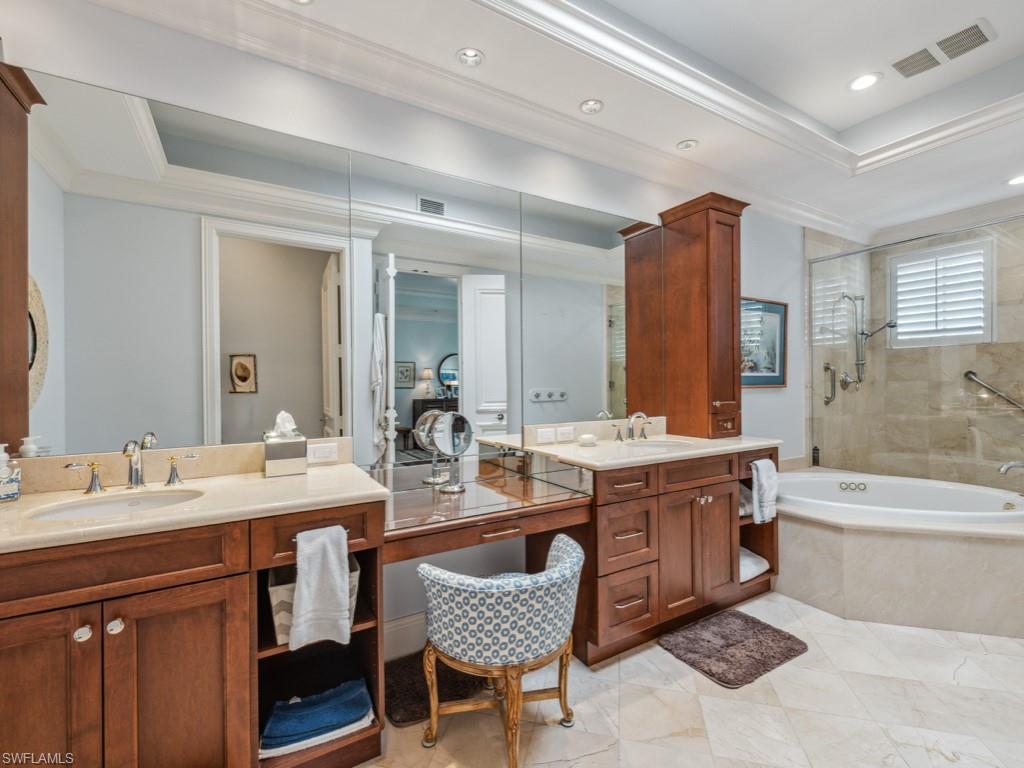 625 5th Avenue South, Unit PH302 Naples, FL 34102 - Photo 15 of 33 Bathroom featuring a tray ceiling, vanity, independent shower and bath, and ornamental molding