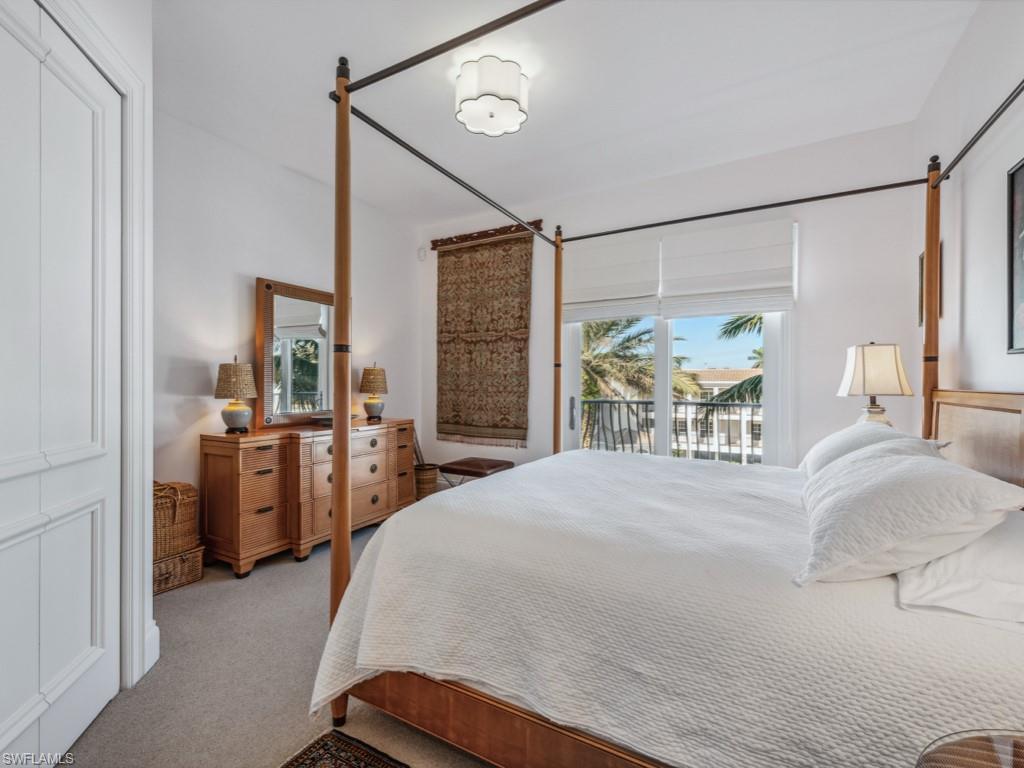 625 5th Avenue South, Unit PH302 Naples, FL 34102 - Photo 17 of 33 Carpeted bedroom with access to outside