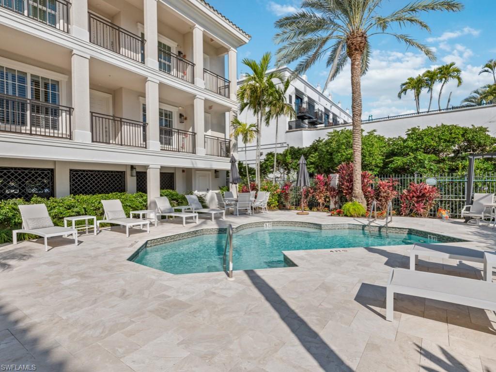 625 5th Avenue South, Unit PH302 Naples, FL 34102 - Photo 24 of 33 View of pool featuring a patio