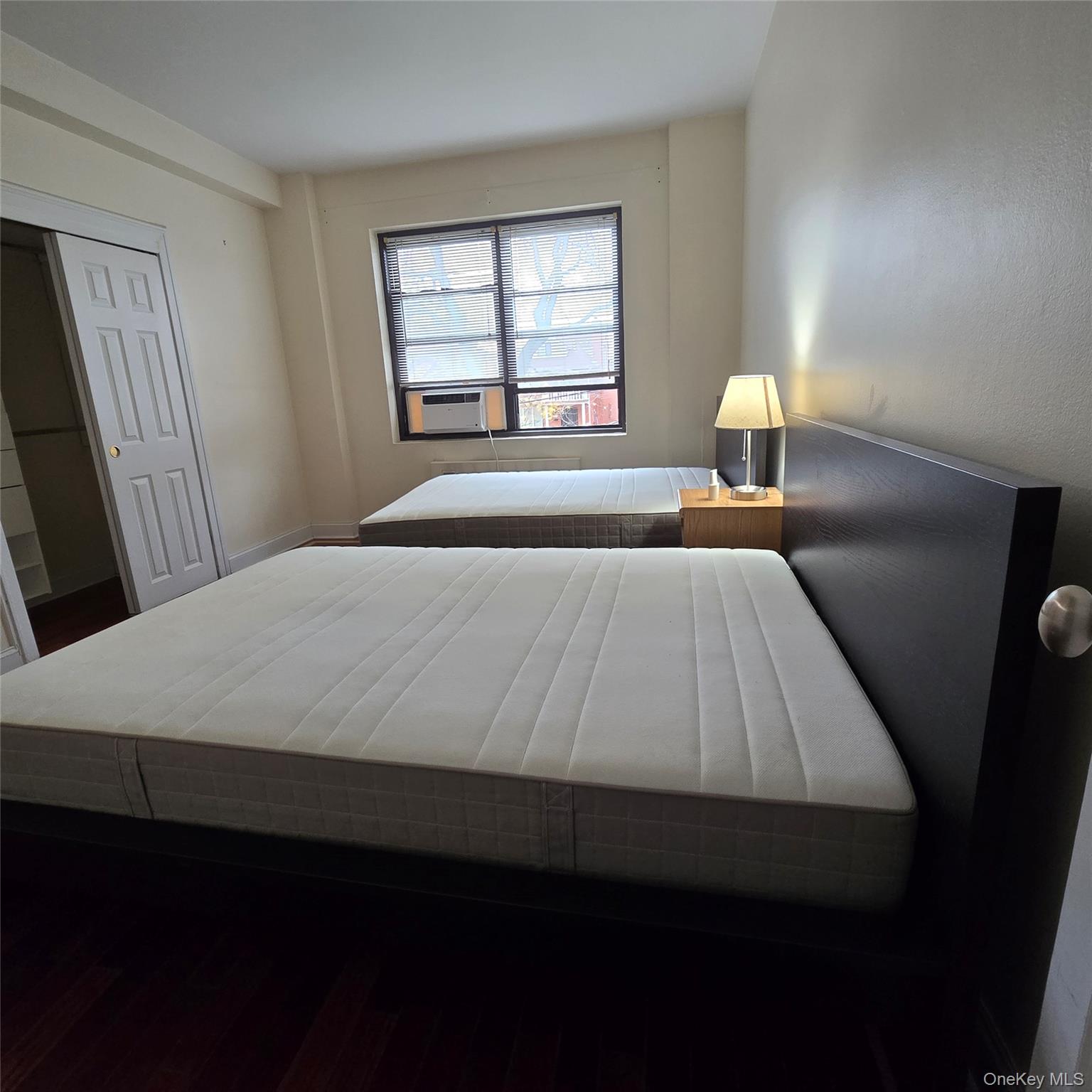 99-40 63rd Road, Unit 1O Queens, NY 11374 - Photo 11 of 14 a bedroom with a bed and window