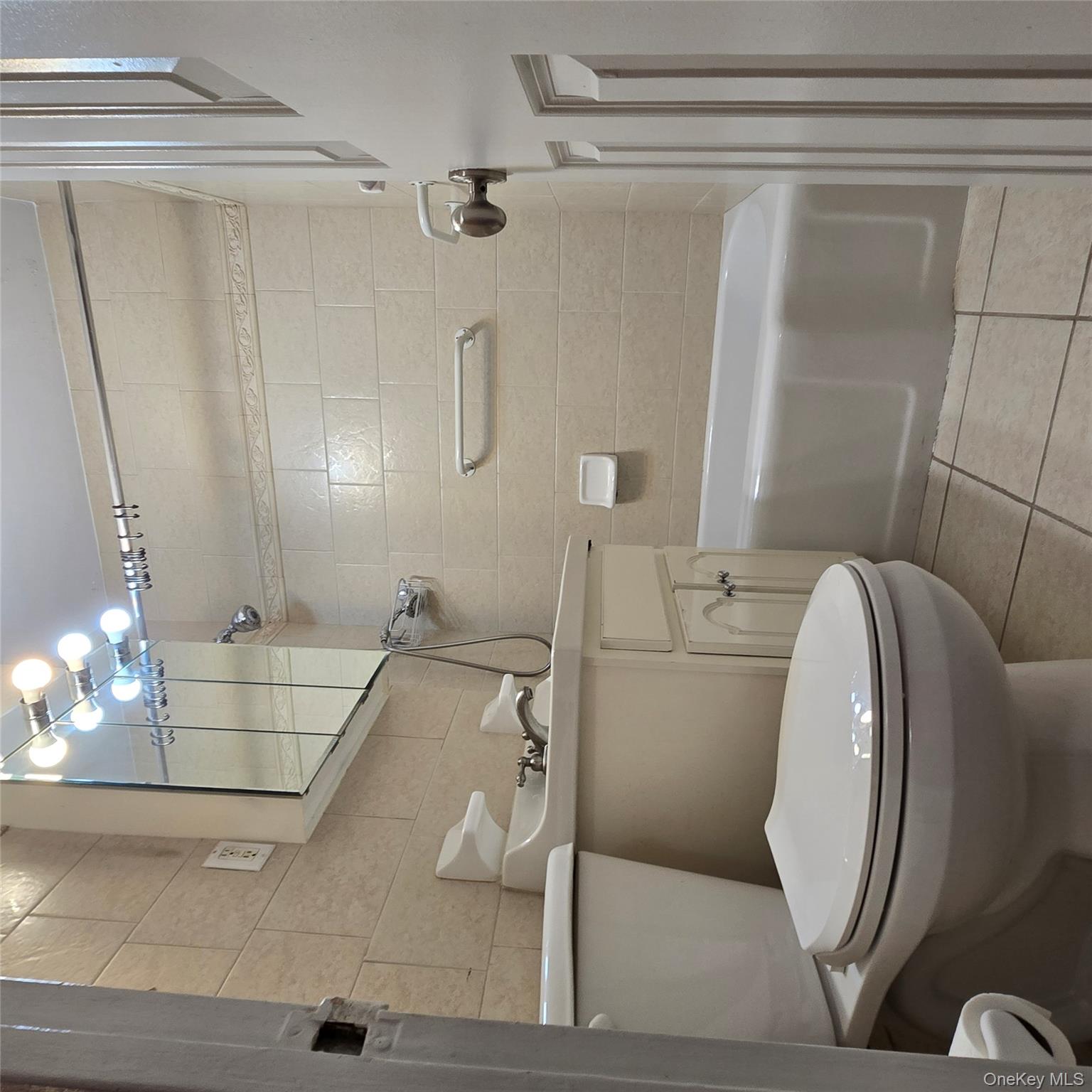 99-40 63rd Road, Unit 1O Queens, NY 11374 - Photo 14 of 14 a bathroom with a toilet a sink and shower