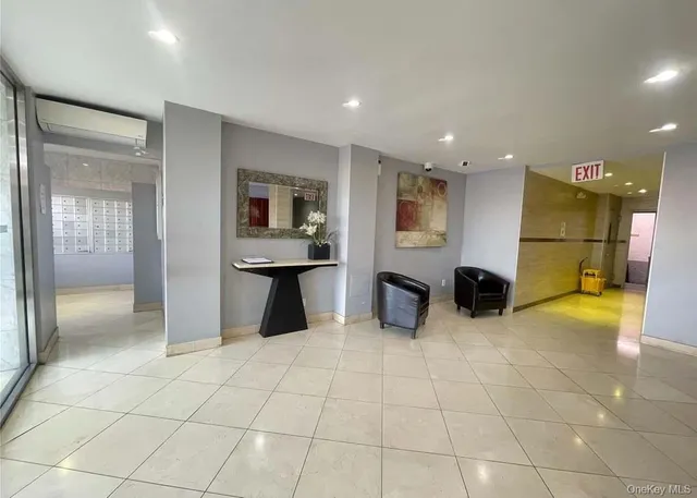 a view of a big room with kitchen and windows