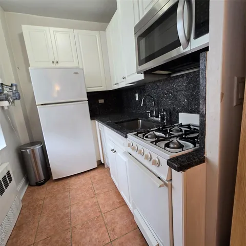 a kitchen with a stove and a microwave