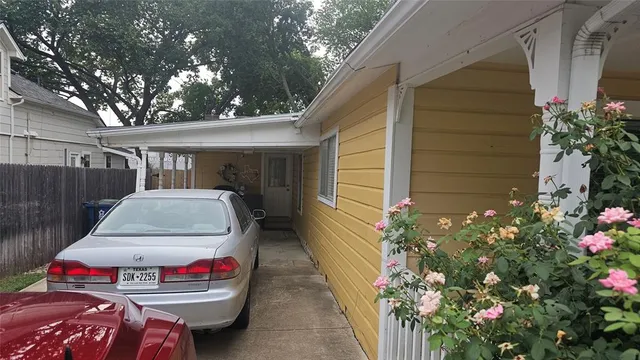 a car parked in front of a house