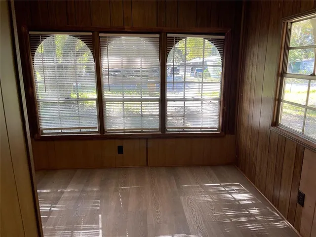 a view of empty room with windows