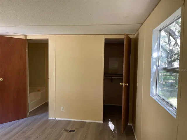 a view of an empty room and window